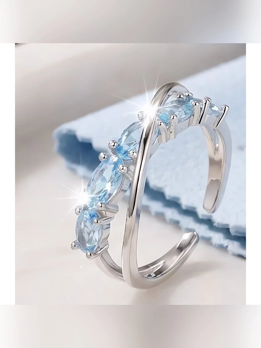 'Criss Cross' simulated Aquamarine ring in Stainless Steel, Adjustable 7-8
